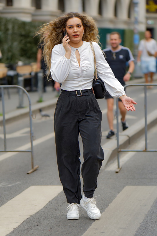 Woman talking phone on the street